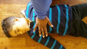 Child being given CPR